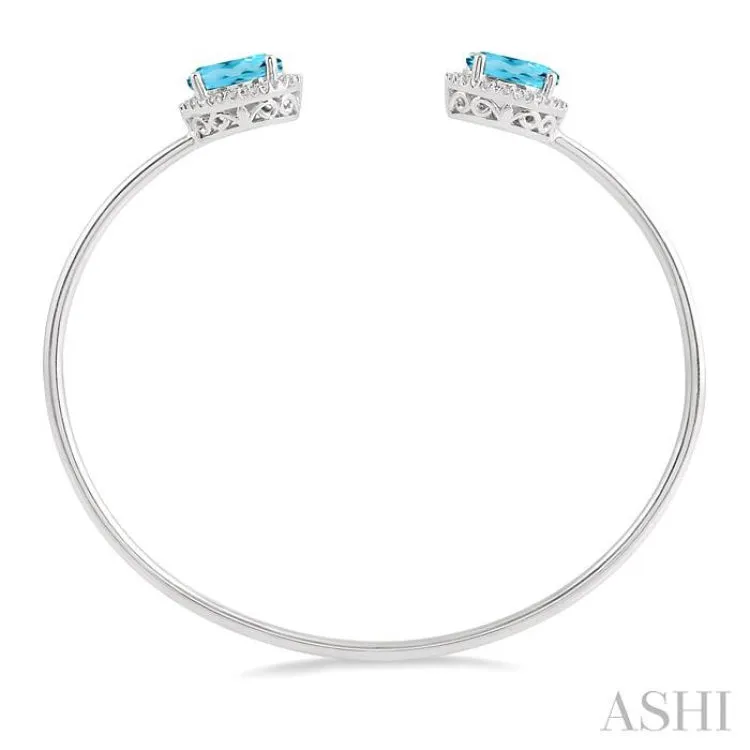 1/10 Ctw Oval Shape 9x7 MM Blue Topaz & Round Cut Diamond Bangle in Sterling Silver