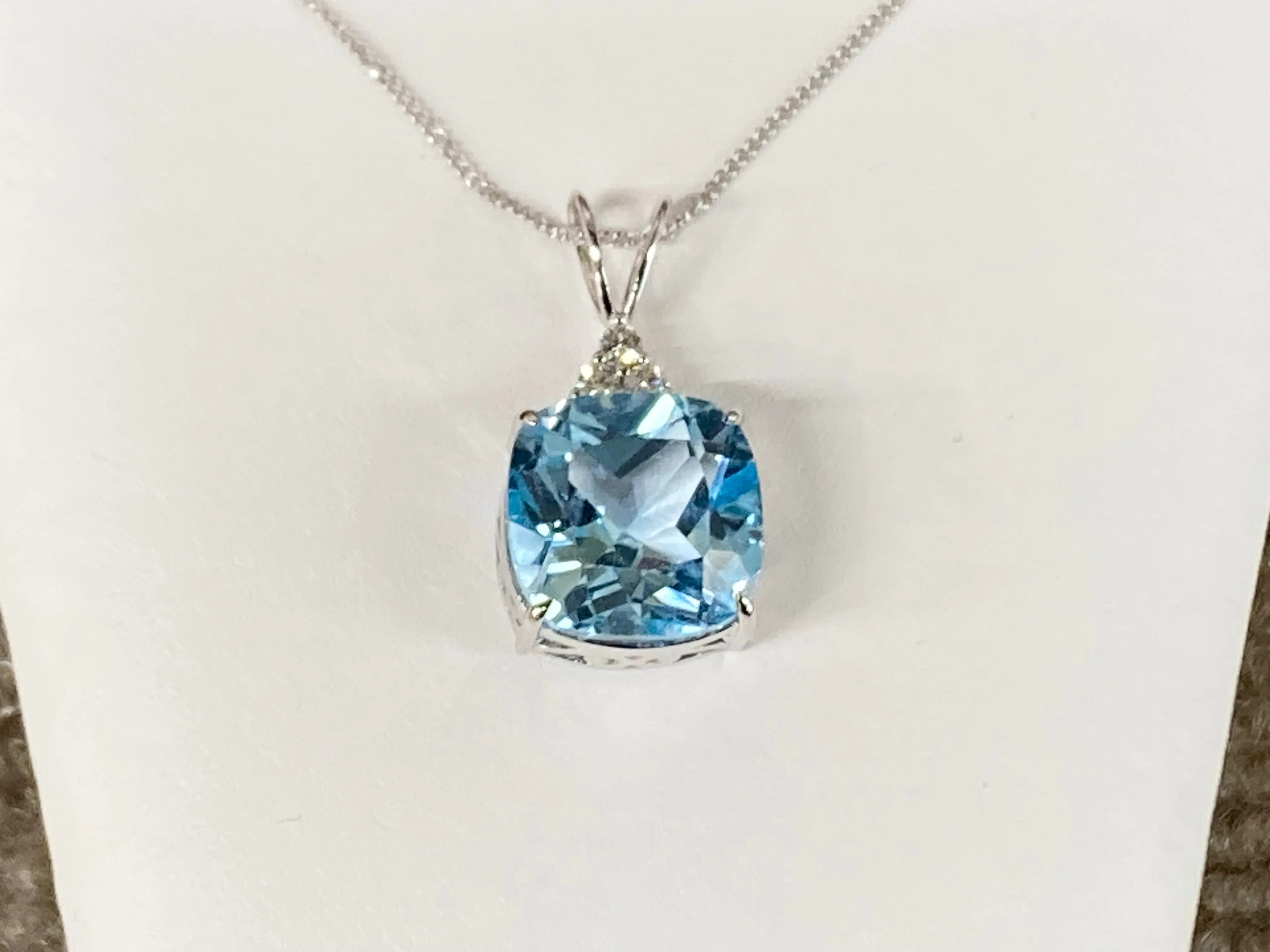 Blue Topaz And Diamond White Gold Pendant