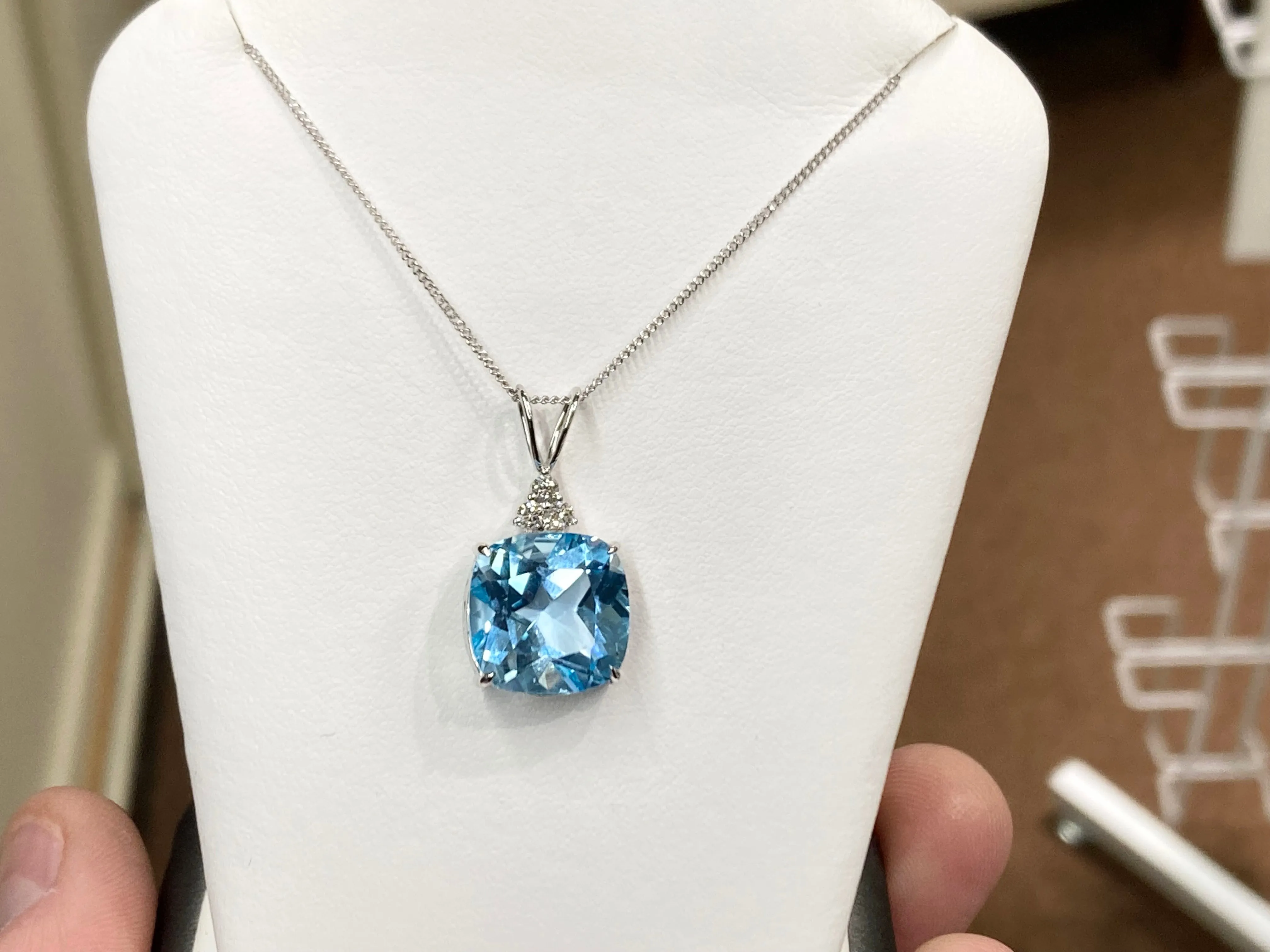 Blue Topaz And Diamond White Gold Pendant