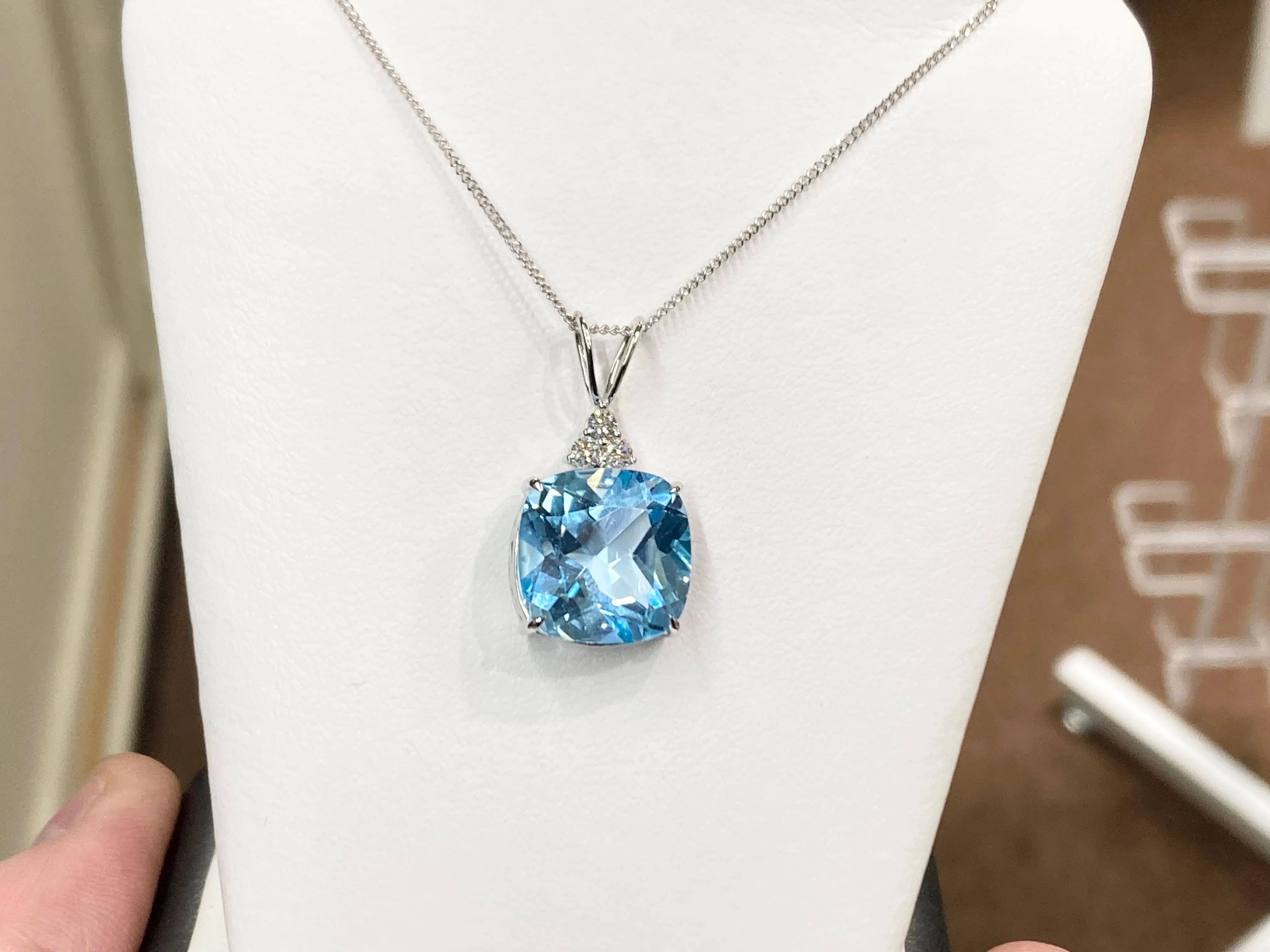 Blue Topaz And Diamond White Gold Pendant