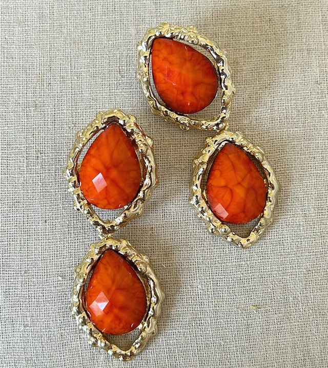 Large pierced style statement size dangle earrings.