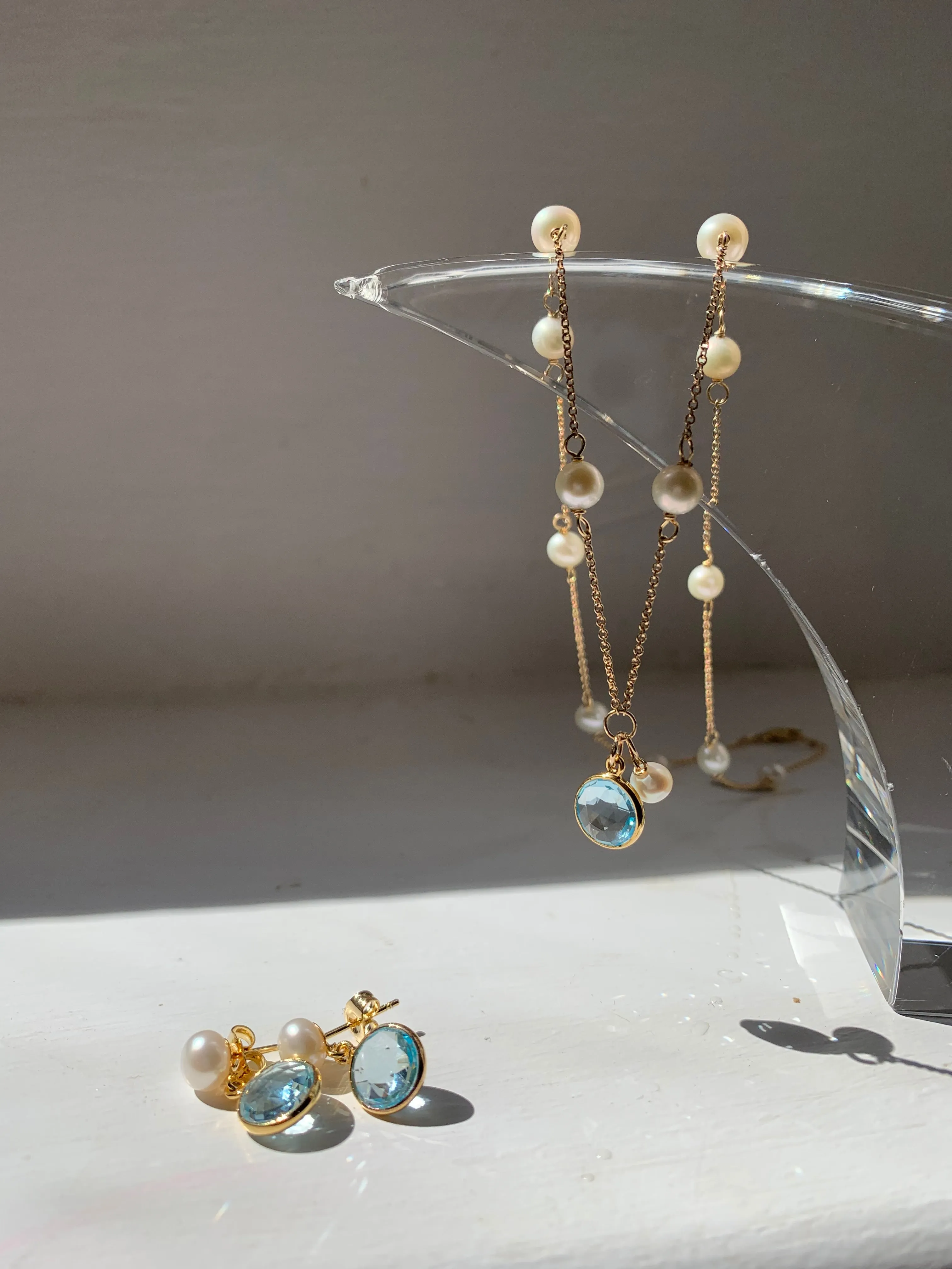 Nova fine chain necklace with cultured freshwater pearls & blue topaz drop