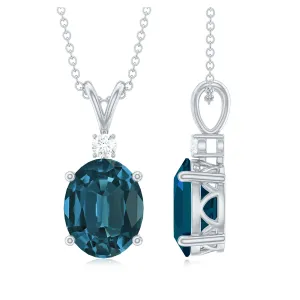 Oval London Blue Topaz Solitaire Pendant with Round Moissanite